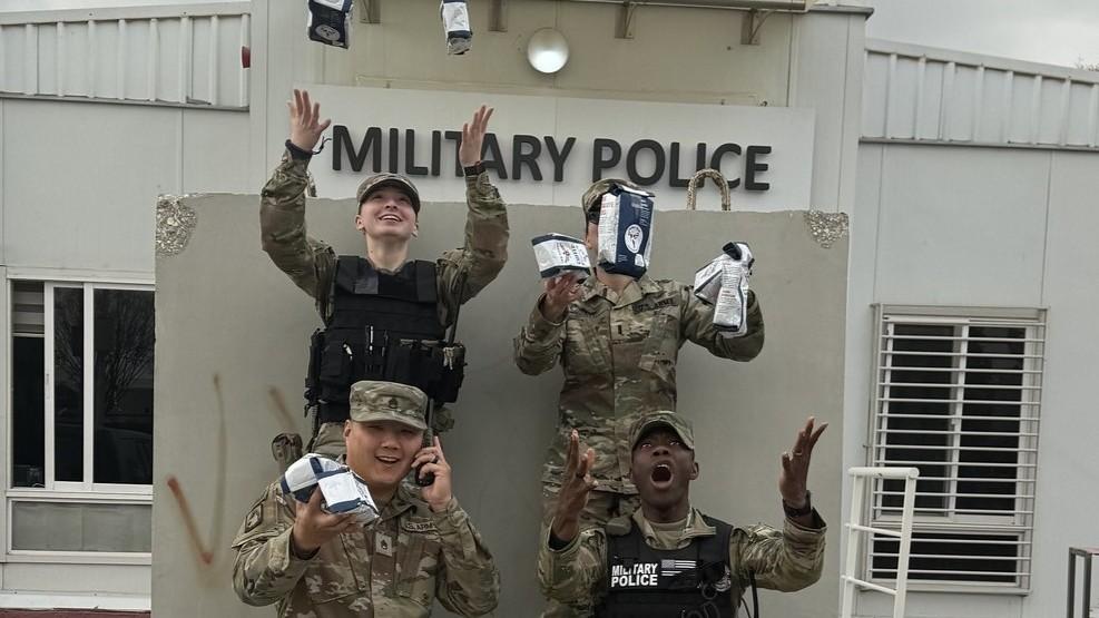 Service Members excited to receive their bags of Joe Muggs coffee from Soldiers' Angels.